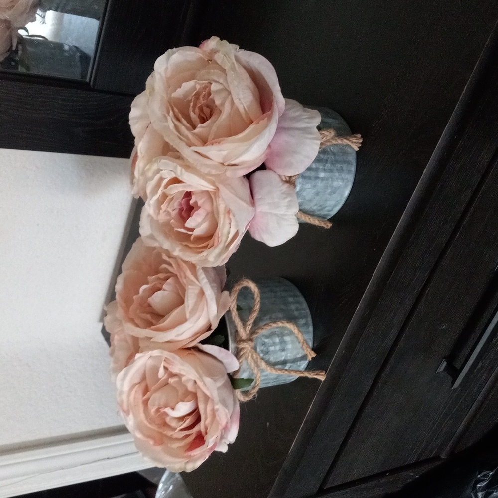 Plastic flowers tin cans